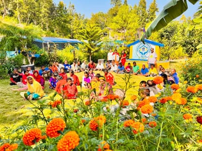 Residents gathered in the marigold garden by the Sahara Ghar emblem in Bardagoriya, Kailali