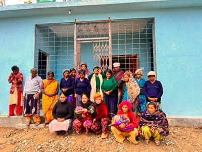 Residents outside the Sahara Ghar shelter building