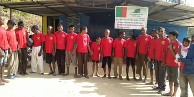 Residents of Sahara Ghar in matching shirts outside the shelter in Kailali